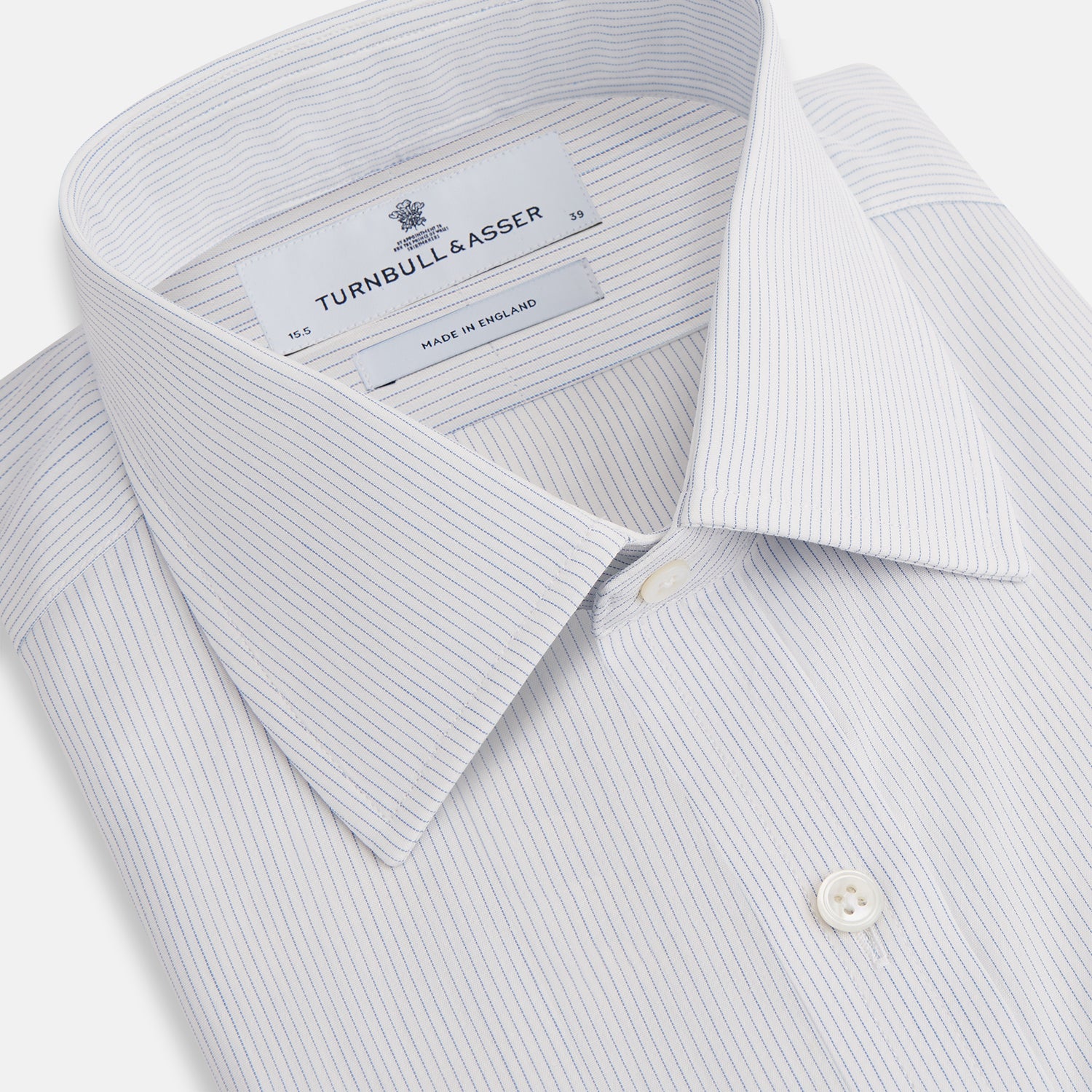 View 2 of product The Blue Pencil Stripe Mayfair Shirt by Turnbull & Asser features light blue stripes, long sleeves, a classic T&A collar, and buttoned cuffs, displayed on a plain white background.