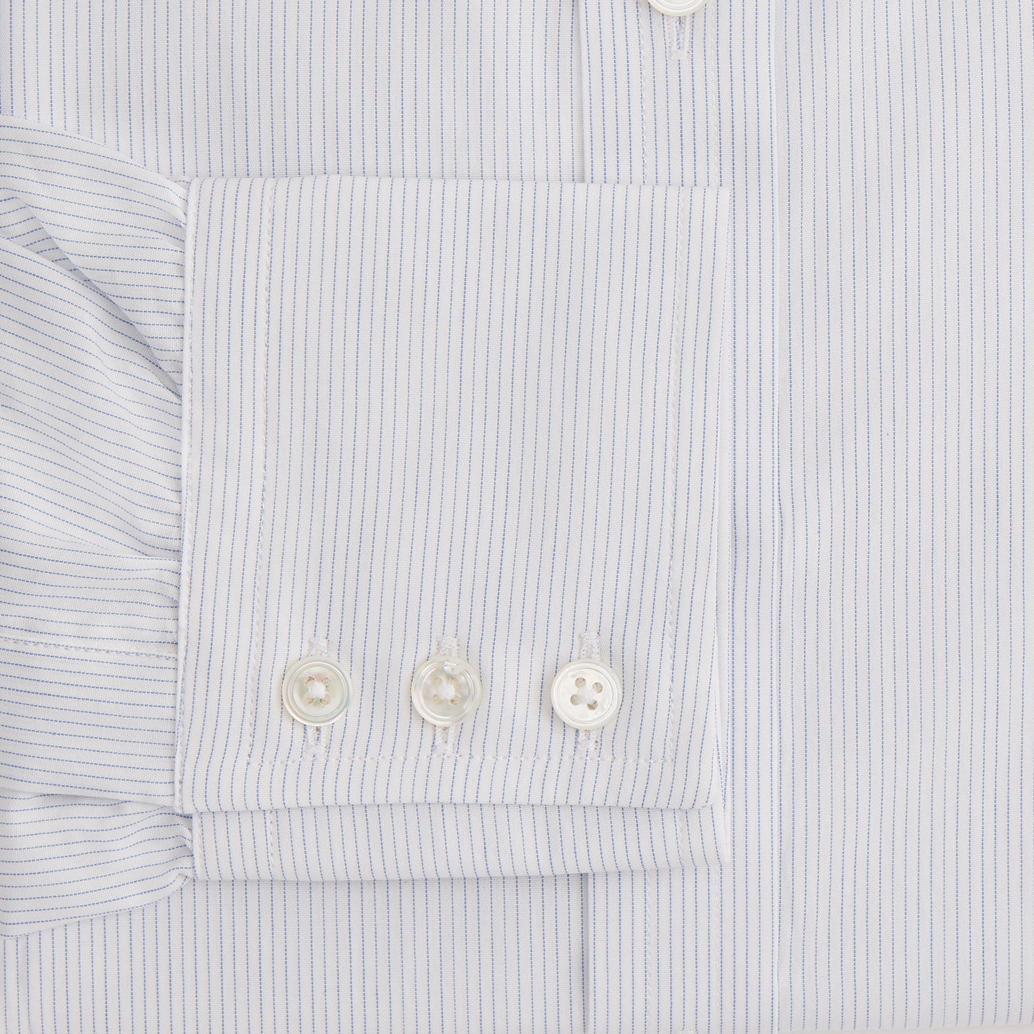 View 3 of product The Blue Pencil Stripe Mayfair Shirt by Turnbull & Asser features light blue stripes, long sleeves, a classic T&A collar, and buttoned cuffs, displayed on a plain white background.
