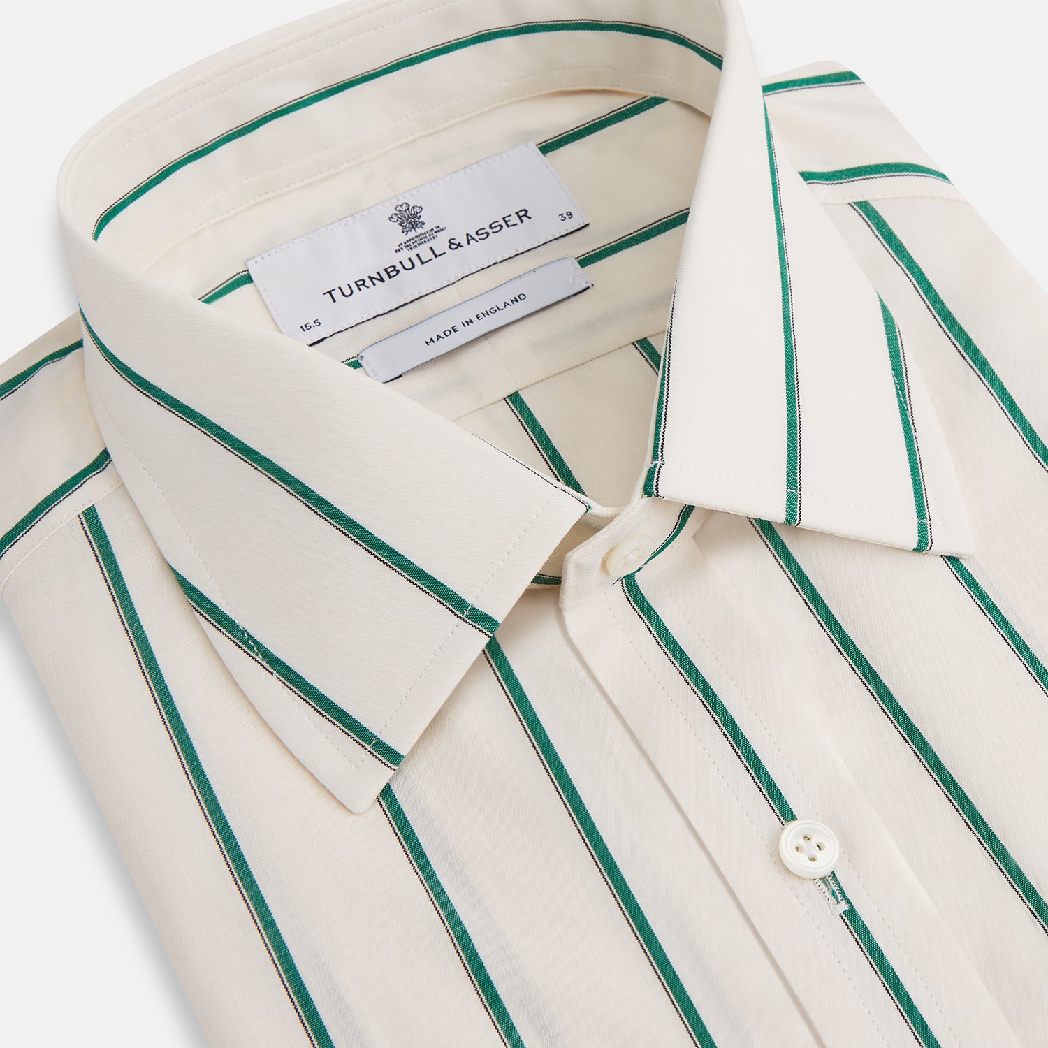 View 2 of product The Turnbull & Asser Green Track Stripe Mayfair Shirt is a long-sleeved, breathable cotton shirt with green vertical stripes, a classic T&A collar, and buttoned cuffs.