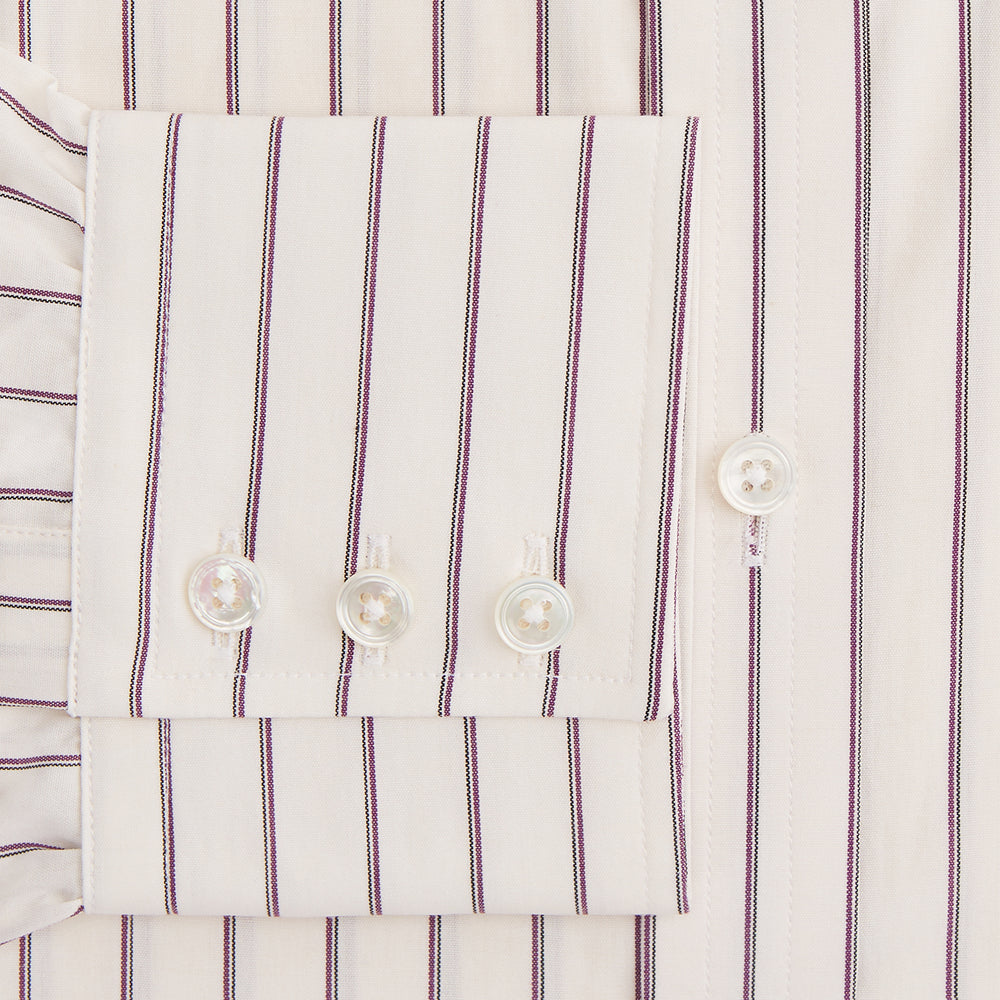 The Purple Halo Stripe Mayfair Shirt by Turnbull & Asser is an organic cotton, long-sleeved shirt with a T&A collar, buttoned cuffs, and thin black stripes on a white base, neatly laid flat on a white background.