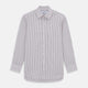 The Turnbull & Asser Purple Track Stripe Mayfair Shirt is a long-sleeve, button-up organic cotton shirt with a T&A collar, showcasing thin vertical black stripes on white and laid flat on a white surface.