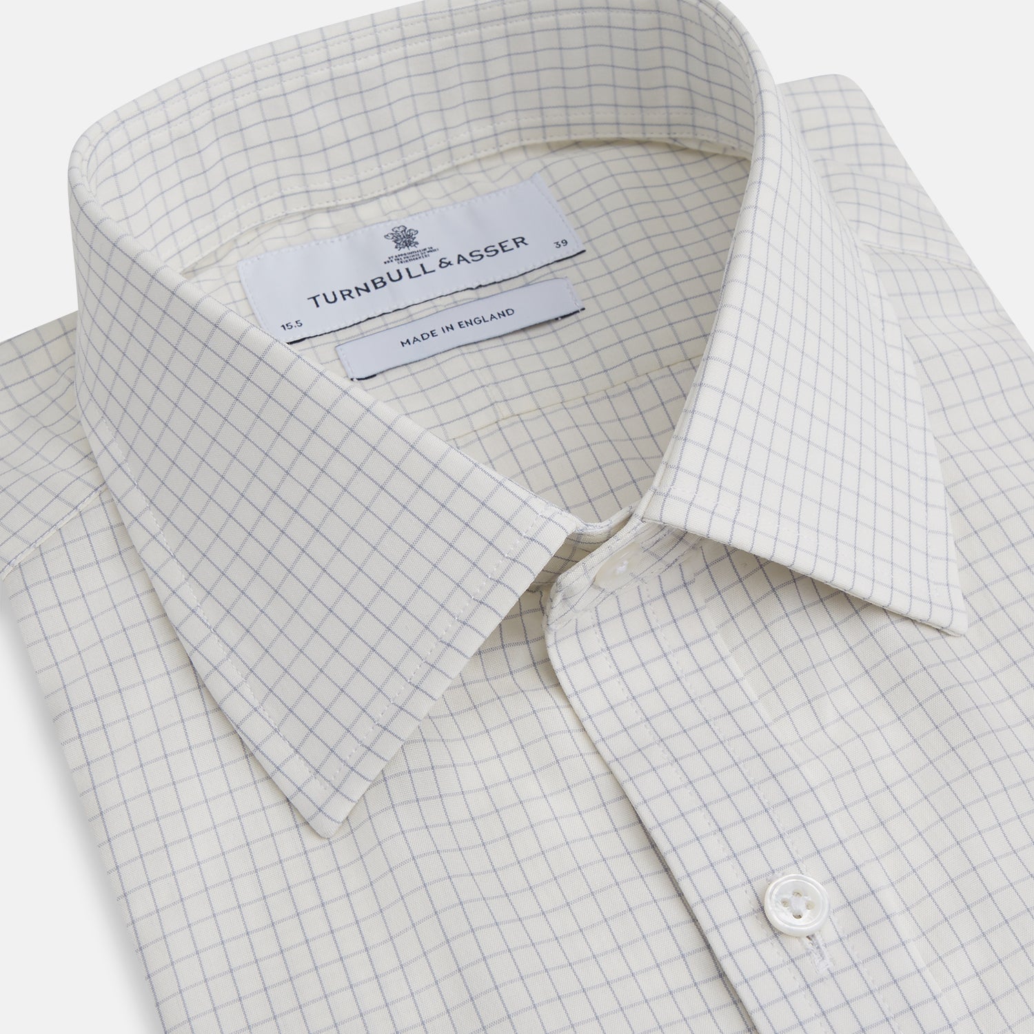 View 2 of product The Turnbull & Asser Pale Blue Graph Check Mayfair Shirt is a long-sleeve, button-up shirt with a pointed collar and buttoned cuffs, crafted from organic cotton—shown here laid flat on a white background.