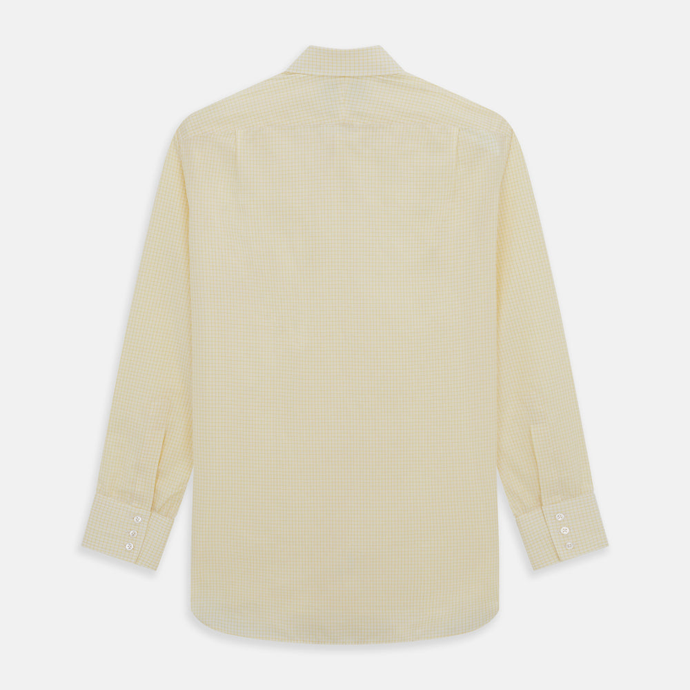 The Turnbull & Asser Yellow Graph Check Mayfair Shirt features long sleeves, a button-up front, and classic T&A collar in organic cotton with a light yellow check pattern—a summer staple shown on a plain white background.