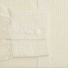 View 3 of product The Turnbull & Asser Yellow Graph Check Mayfair Shirt features long sleeves, a button-up front, and classic T&A collar in organic cotton with a light yellow check pattern—a summer staple shown on a plain white background.