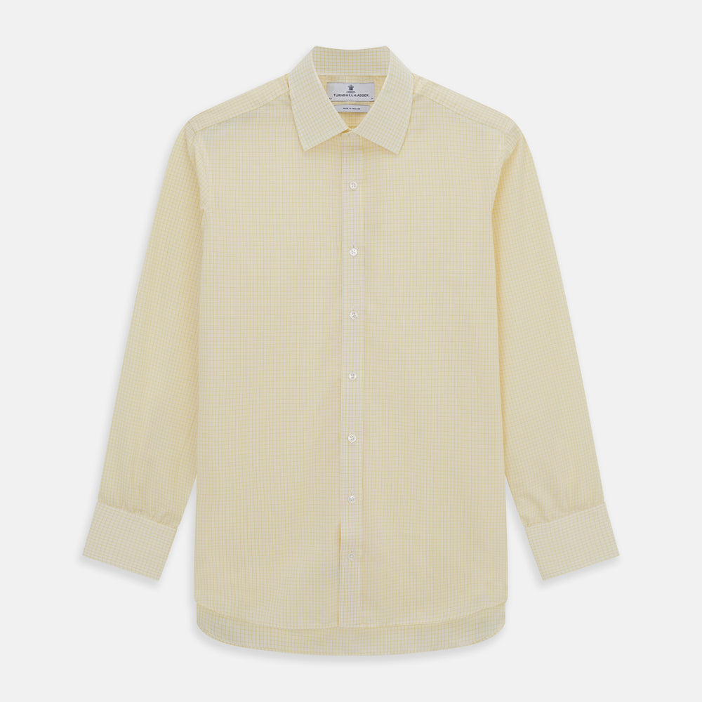 The Turnbull & Asser Yellow Graph Check Mayfair Shirt features long sleeves, a button-up front, and classic T&A collar in organic cotton with a light yellow check pattern—a summer staple shown on a plain white background.