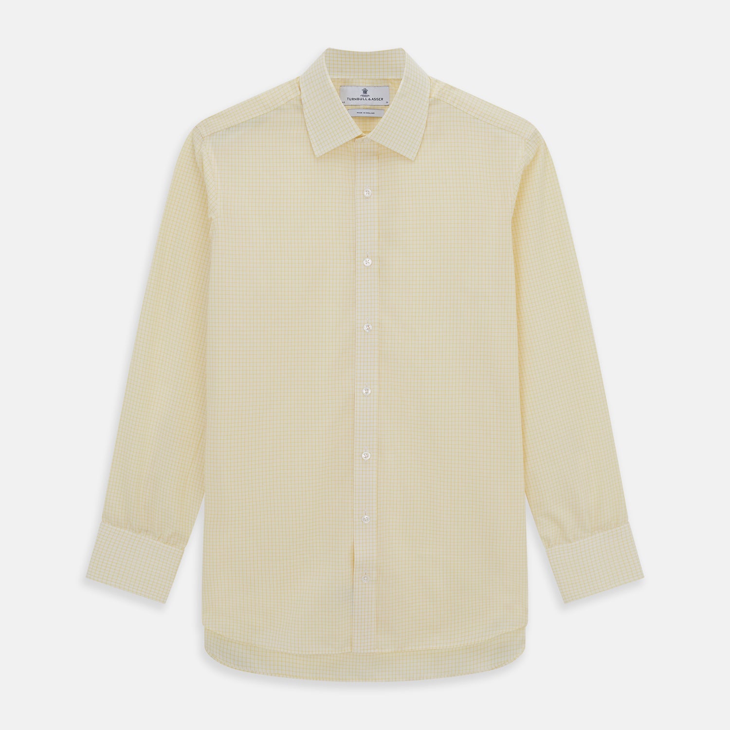 View 1 of product The Turnbull & Asser Yellow Graph Check Mayfair Shirt features long sleeves, a button-up front, and classic T&A collar in organic cotton with a light yellow check pattern—a summer staple shown on a plain white background.