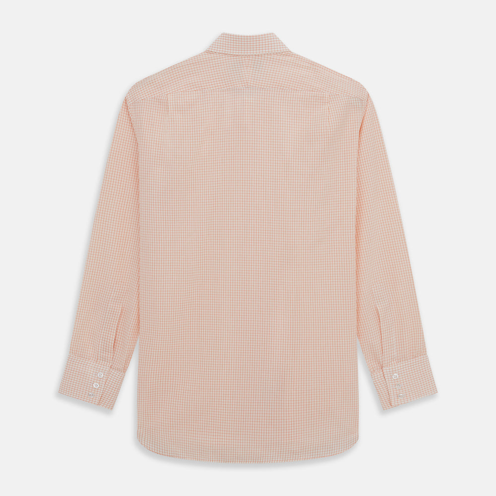The Turnbull & Asser Orange Graph Check Mayfair Shirt features a classic T&A collar, long sleeves, buttoned cuffs, and a peach and white check pattern, shown against a white background.