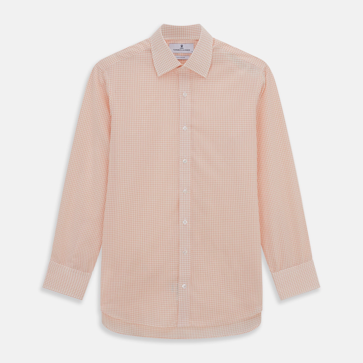 View 1 of product The Turnbull & Asser Orange Graph Check Mayfair Shirt features a classic T&A collar, long sleeves, buttoned cuffs, and a peach and white check pattern, shown against a white background.