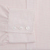 View 3 of product The Pink Graph Check Mayfair Shirt by Turnbull & Asser is an organic cotton, long-sleeve button-down with a classic collar and buttoned cuffs, featuring a subtle light pink and white graph check pattern, shown laid flat on a white background.