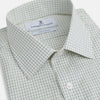 View 2 of product The Turnbull & Asser Dark Green Graph Check Mayfair Shirt, featuring a classic T&A collar and cuffs, displays a small green and white check pattern and is shown laid flat on a white background.