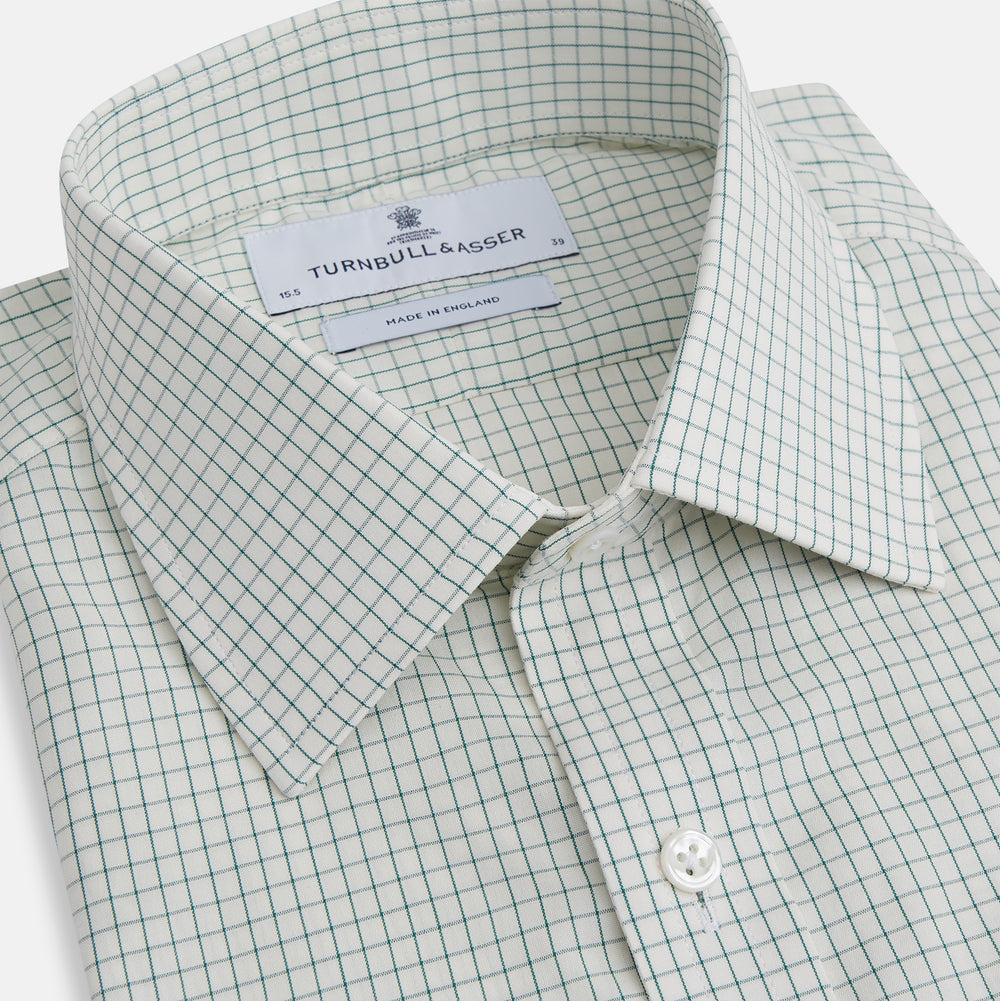 The Turnbull & Asser Dark Green Graph Check Mayfair Shirt, featuring a classic T&A collar and cuffs, displays a small green and white check pattern and is shown laid flat on a white background.