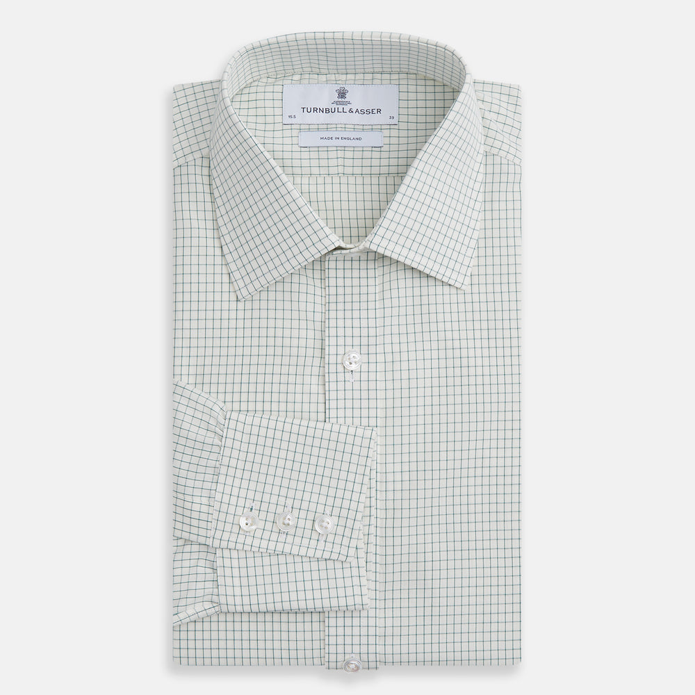 The Turnbull & Asser Dark Green Graph Check Mayfair Shirt, featuring a classic T&A collar and cuffs, displays a small green and white check pattern and is shown laid flat on a white background.