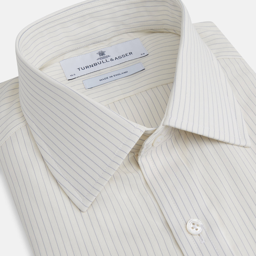 The Turnbull & Asser Pale Blue Pinstripe Mayfair Shirt is a long-sleeve, collared, button-up made from organic cotton with a subtle pale blue and white pinstripe pattern, shown against a plain white background.