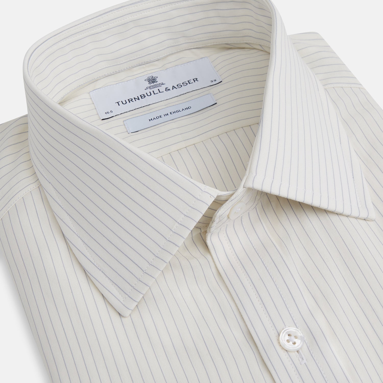 View 2 of product The Turnbull & Asser Pale Blue Pinstripe Mayfair Shirt is a long-sleeve, collared, button-up made from organic cotton with a subtle pale blue and white pinstripe pattern, shown against a plain white background.