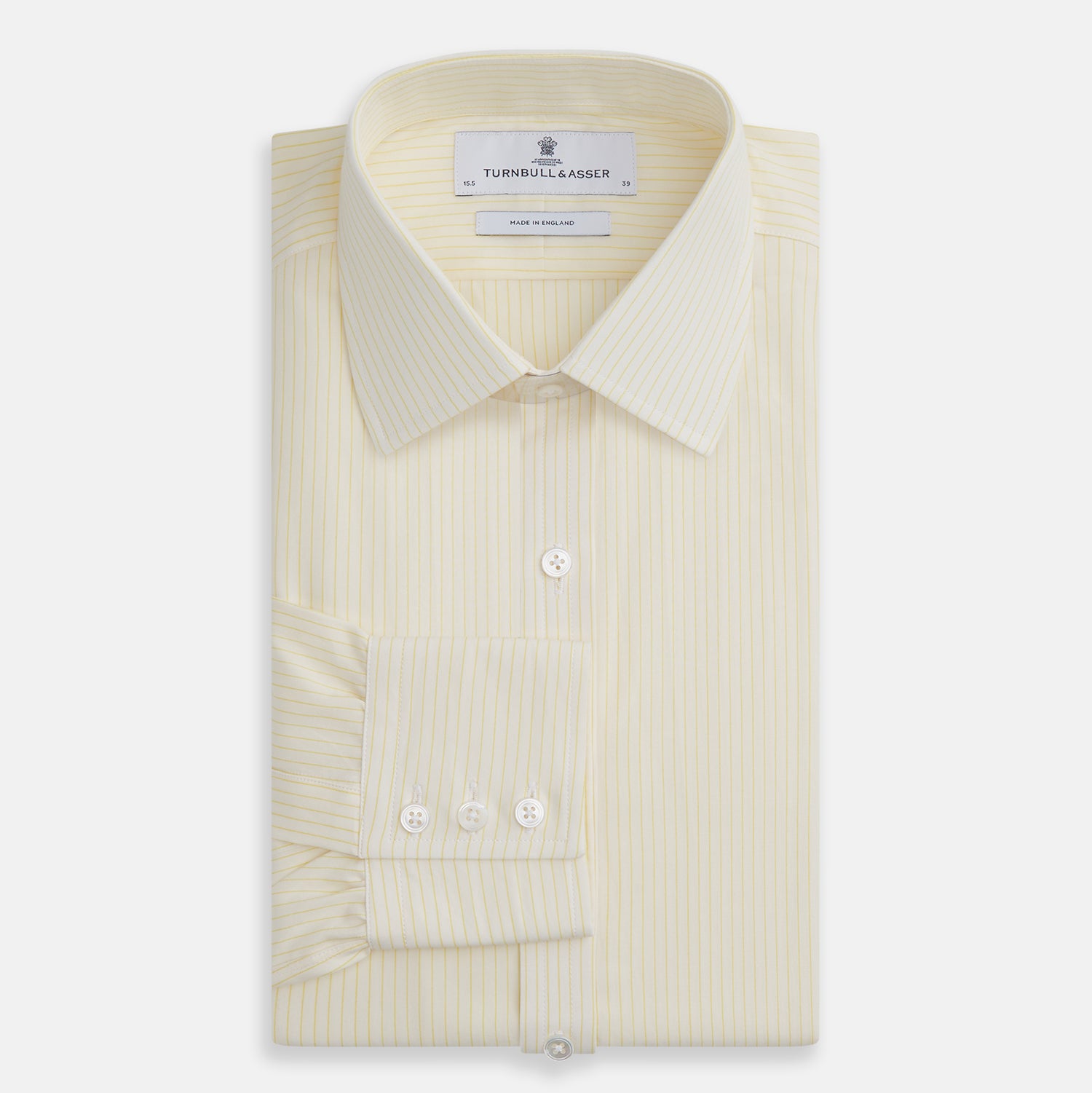 View 4 of product The Turnbull & Asser Yellow Pinstripe Mayfair Shirt, made from organic cotton with long sleeves, a T&A collar, and front buttons, features subtle vertical stripes and is shown on a plain white background.