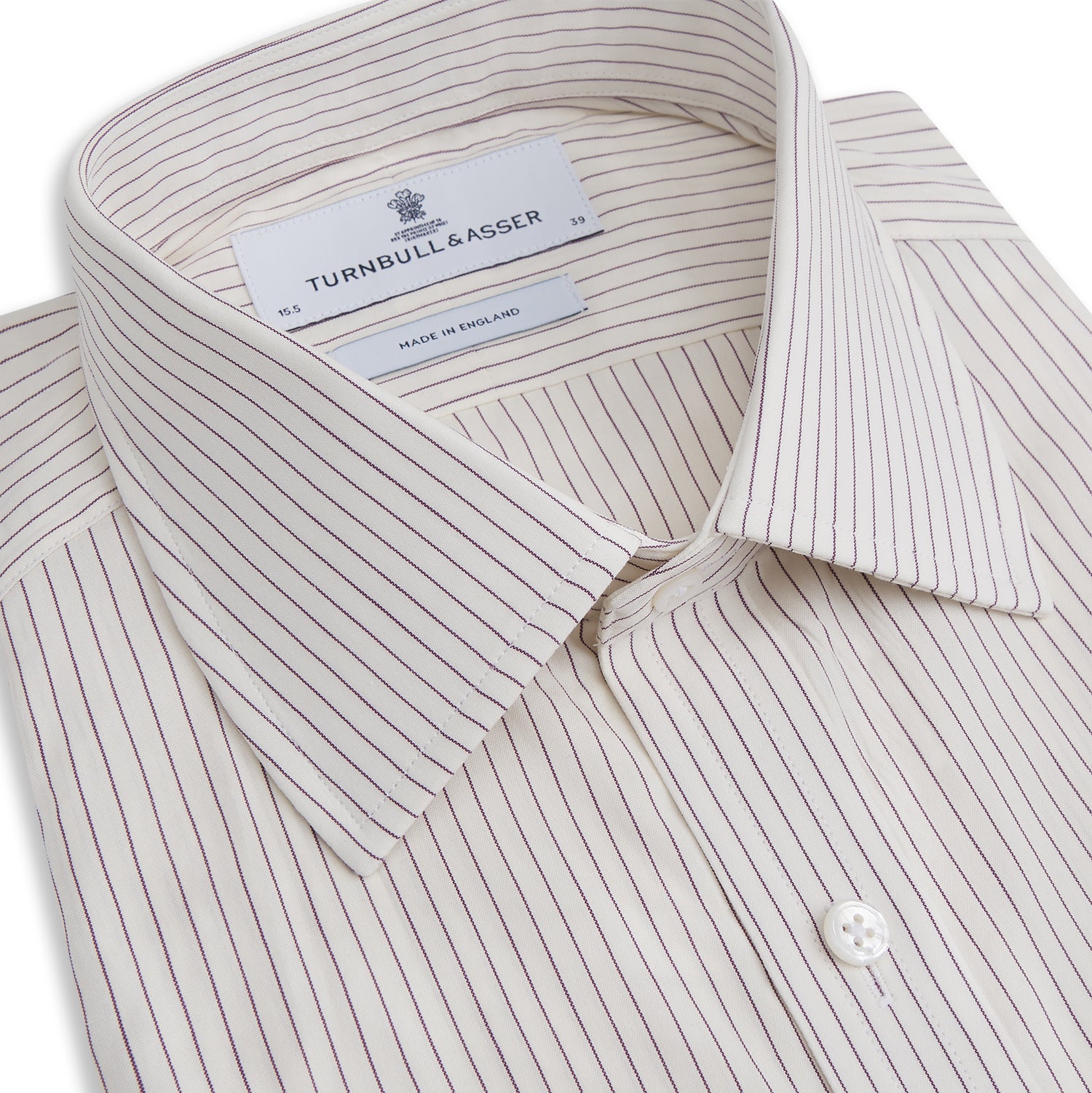 View 2 of product The Turnbull & Asser Purple Pinstripe Mayfair Stripe Shirt is a long-sleeve button-up with a collar, shown laid flat on a white background.