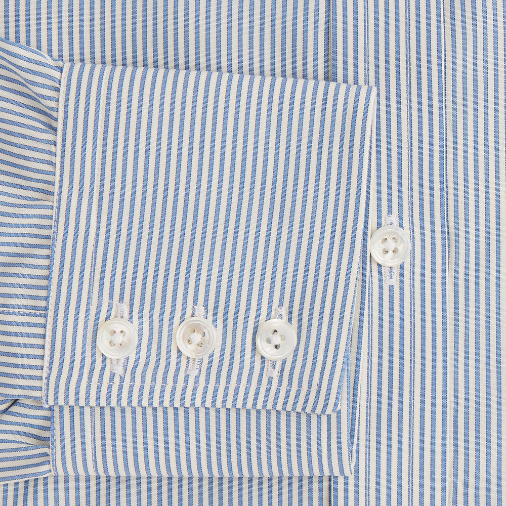 The Turnbull & Asser Blue and White Pencil Stripe Mayfair Shirt features breathable cotton, a standard collar, buttoned cuffs, and white buttons, shown laid flat on a white background.