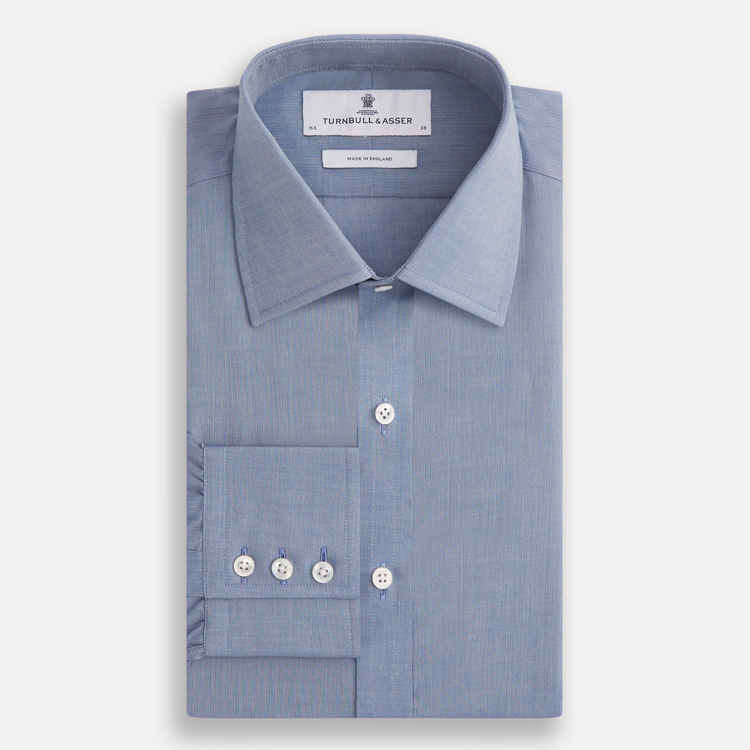 View 4 of product The Blue Mayfair Shirt by Turnbull & Asser is a long-sleeve, textured blue shirt with a classic T&A collar and white buttons, crafted from organic cotton and shown against a plain white background.