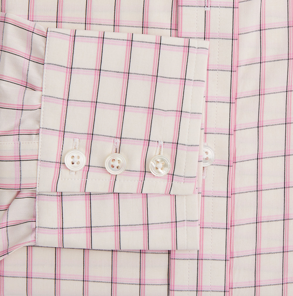 The Pink Shadow Check Mayfair Shirt by Turnbull & Asser is a long-sleeve, button-up cotton shirt with a collar, white base, and pink/red checks. It features buttoned cuffs and is shown neatly laid flat on a white background.