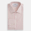 View 4 of product The Pink Shadow Check Mayfair Shirt by Turnbull & Asser is a long-sleeve, button-up cotton shirt with a collar, white base, and pink/red checks. It features buttoned cuffs and is shown neatly laid flat on a white background.