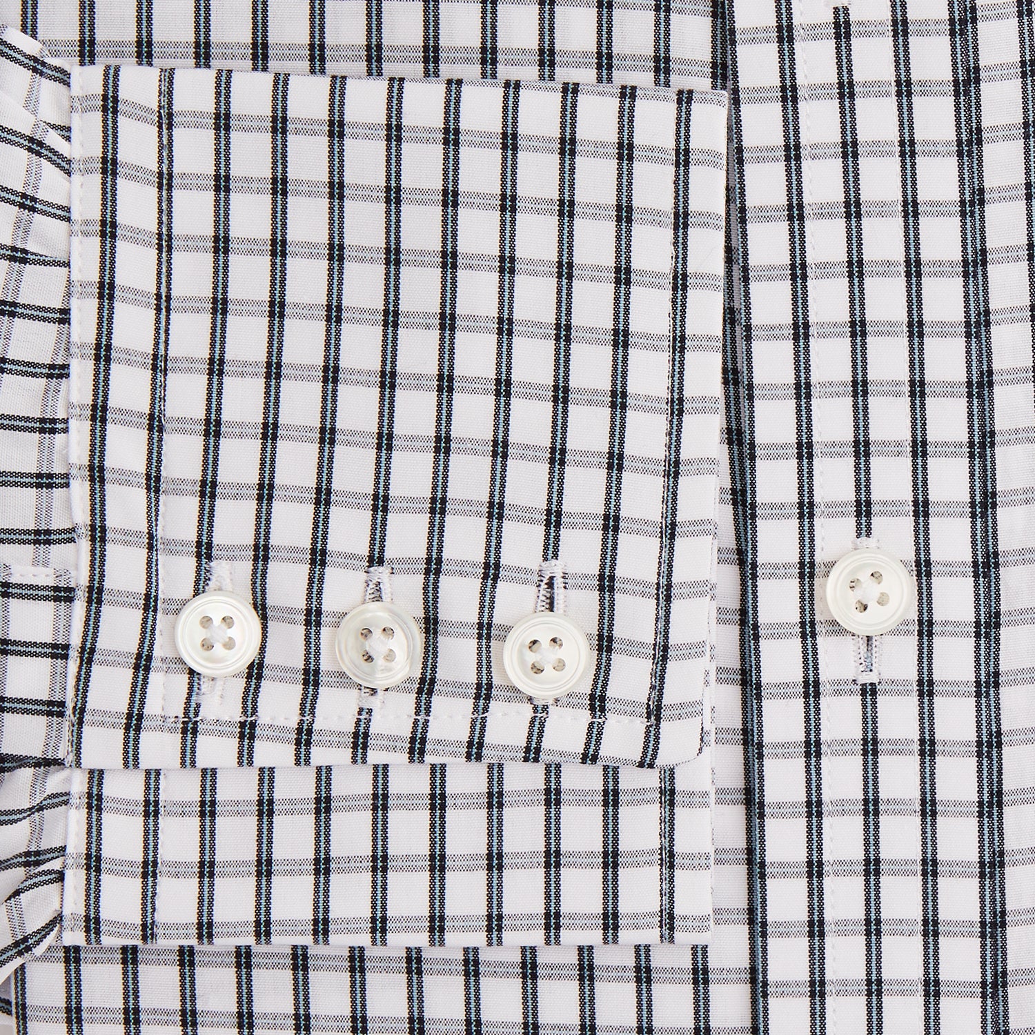 View 3 of product The Turnbull & Asser Midnight Blue Double Graph Check Mayfair Shirt features a pointed collar and buttoned cuffs. Crafted from breathable cotton, this stylish shirt ensures comfort and is shown against a white background.