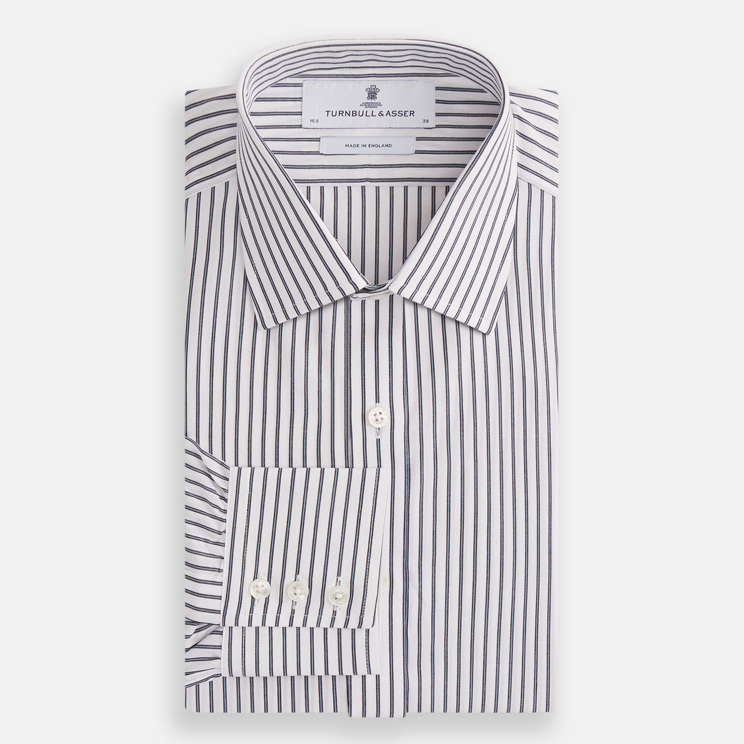 View 4 of product The Turnbull & Asser Midnight Blue Halo Stripe Mayfair Shirt features breathable cotton with black and white vertical stripes, a pointed T&A collar, and buttoned cuffs, displayed flat on a white background.