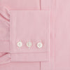 View 4 of product The Pink Fine Stripe Mayfair Shirt by Turnbull & Asser features fine white stripes, a classic T&A collar, visible white button, and is made from organic cotton in England.