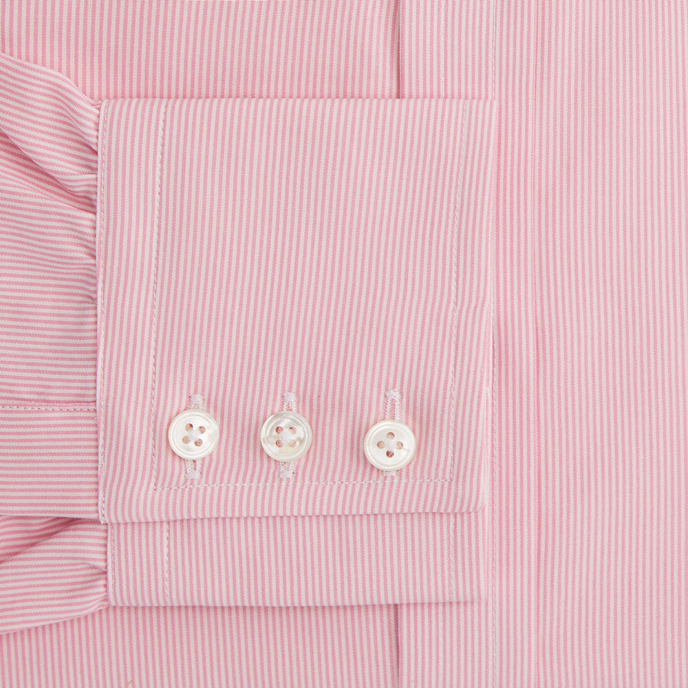 The Pink Fine Stripe Mayfair Shirt by Turnbull & Asser features fine white stripes, a classic T&A collar, visible white button, and is made from organic cotton in England.