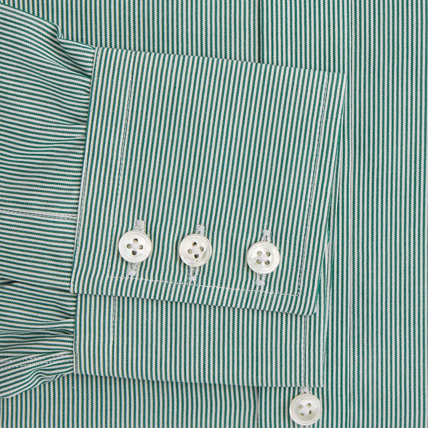 View 3 of product The Turnbull & Asser Green Fine Stripe Mayfair Shirt features long sleeves, a classic T&A collar, white buttons, and is showcased against a plain white background.