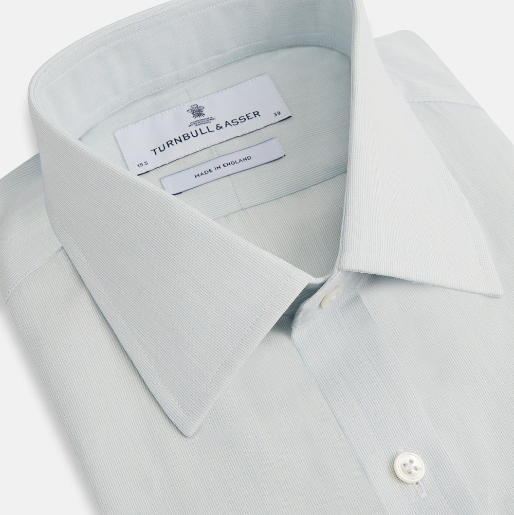 Pale Blue Pencil Stripe Mayfair Shirt by Turnbull & Asser featuring a classic collar, white buttons, and cuffed long sleeves, displayed flat on a white background.