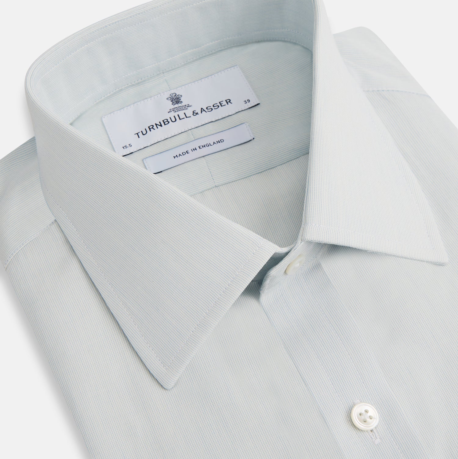 View 2 of product Pale Blue Pencil Stripe Mayfair Shirt by Turnbull & Asser featuring a classic collar, white buttons, and cuffed long sleeves, displayed flat on a white background.