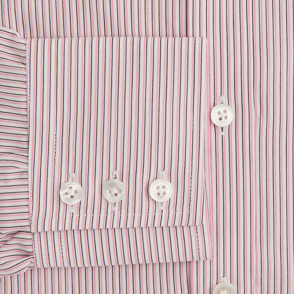 The Turnbull & Asser Pink Fine Shadow Stripe Mayfair Shirt is a long-sleeved button-up with a classic T&A collar, crafted from pure cotton and featuring thin pink and white vertical stripes, shown on a plain white background.