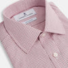 View 2 of product The Turnbull & Asser Pink Fine Graph Check Mayfair Shirt features long sleeves, breathable cotton, a pointed collar, 3-button cuffs, white buttons, and a red and white check pattern—shown on a plain white background.