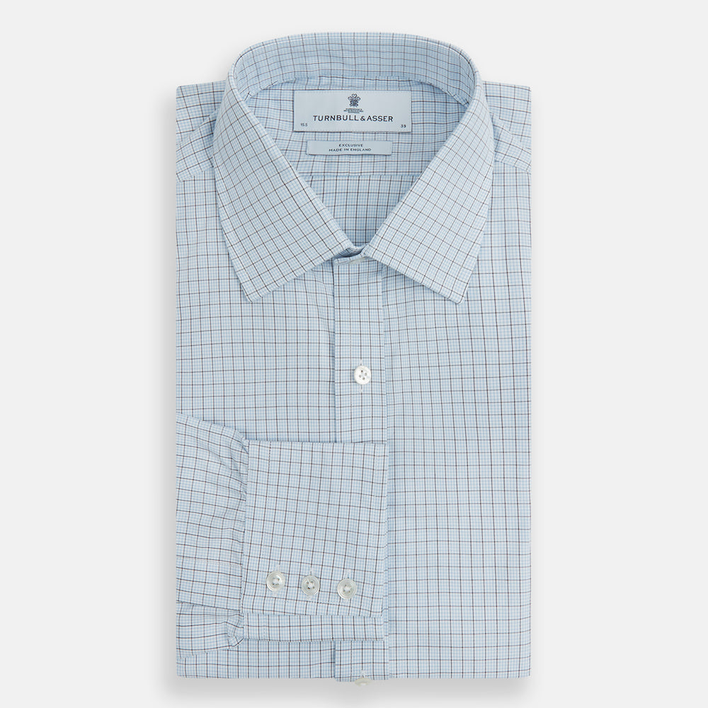 The Blue Multi Graph Check Mayfair Shirt by Turnbull & Asser features long sleeves, a classic T&A collar, chest pocket, and is crafted from breathable cotton, shown on a white background.