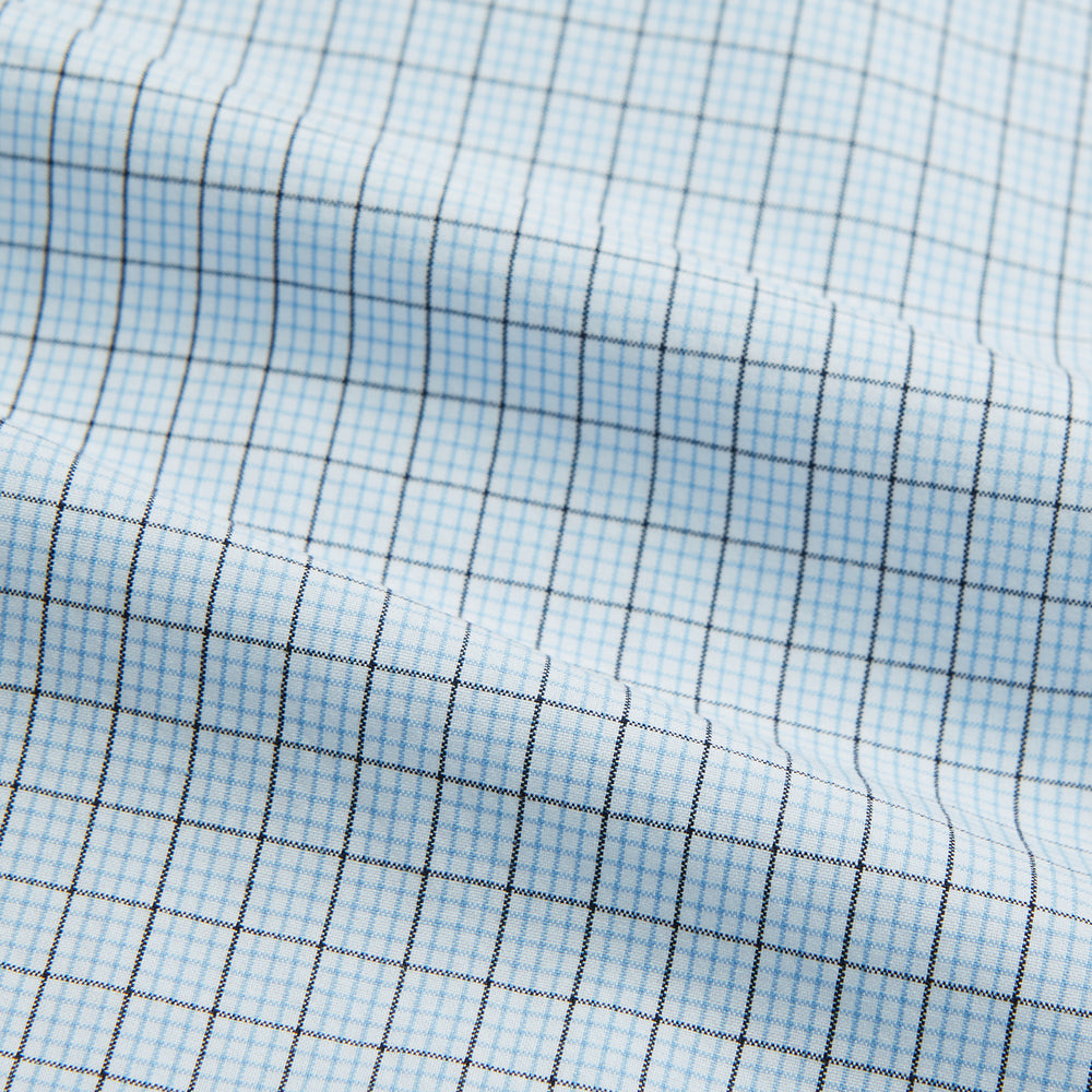The Blue Multi Graph Check Mayfair Shirt by Turnbull & Asser features long sleeves, a classic T&A collar, chest pocket, and is crafted from breathable cotton, shown on a white background.