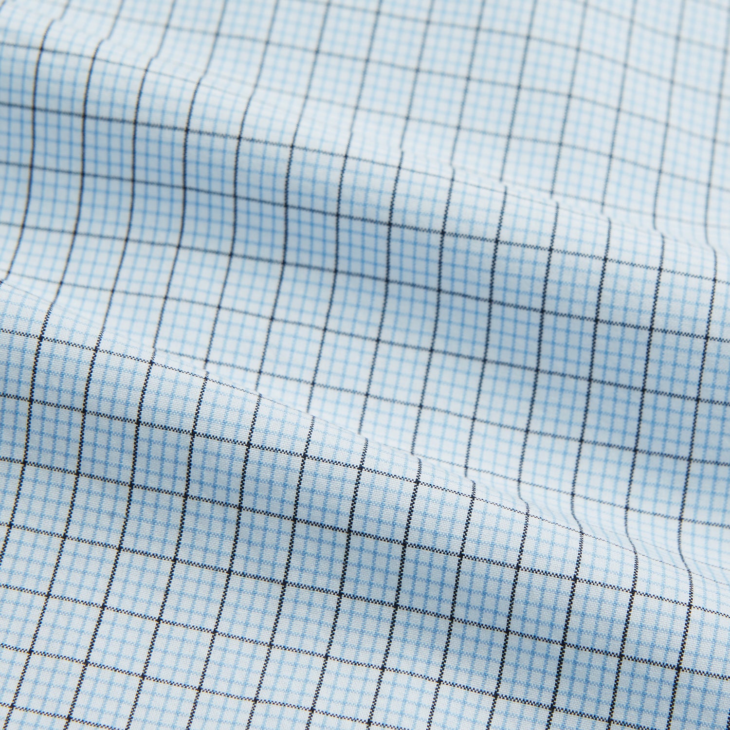 View 5 of product The Blue Multi Graph Check Mayfair Shirt by Turnbull & Asser features long sleeves, a classic T&A collar, chest pocket, and is crafted from breathable cotton, shown on a white background.