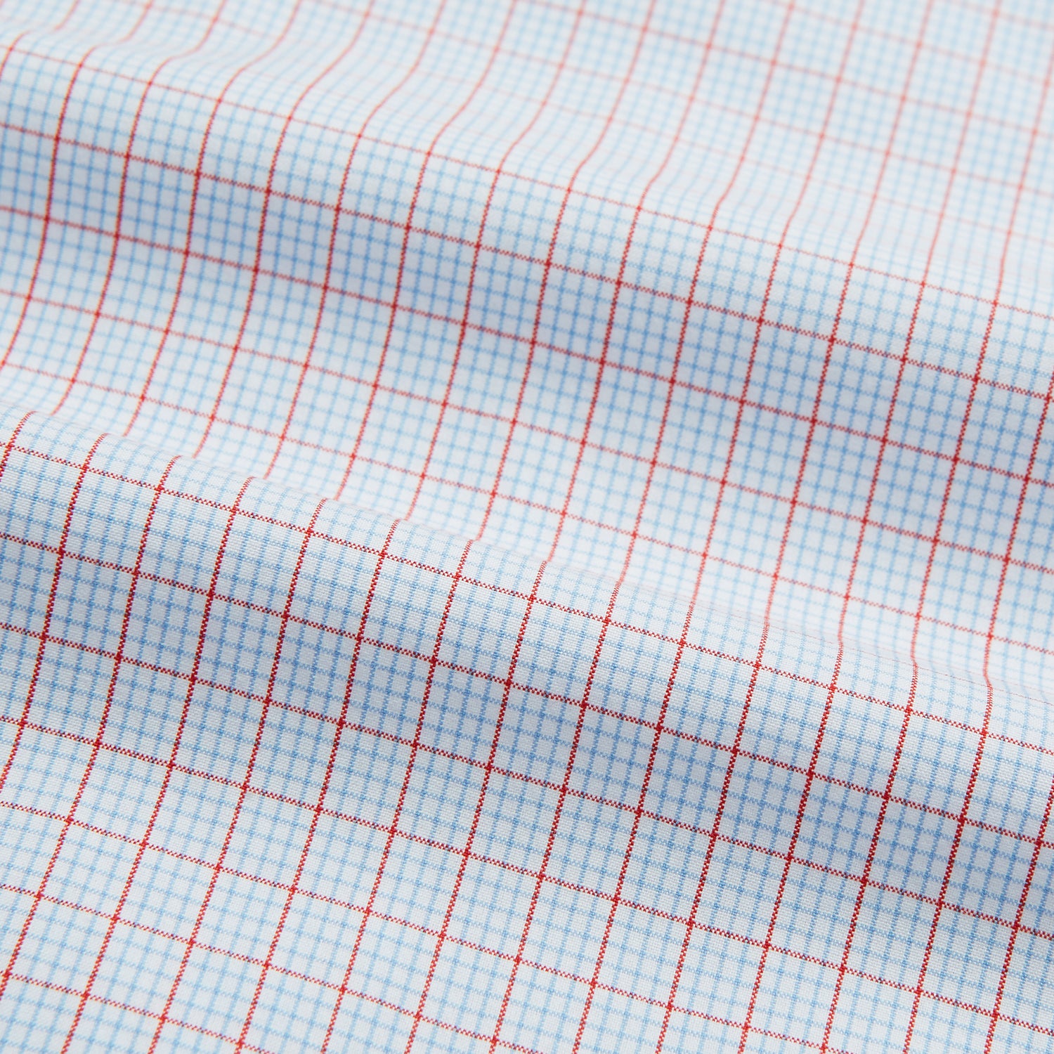 View 5 of product Red multi graph check long-sleeve Mayfair shirt by Turnbull & Asser, featuring a pointed collar and buttoned cuffs, crafted from breathable cotton and laid flat against a white background.