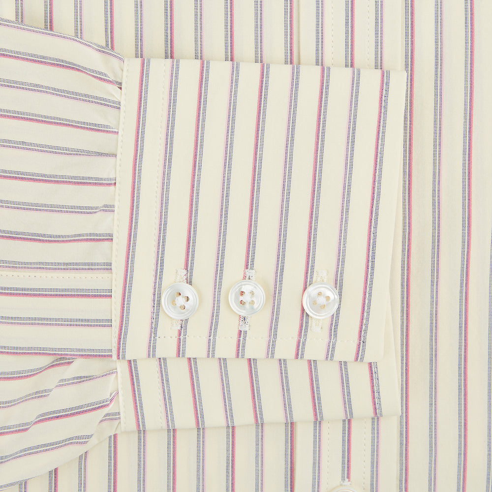 The Turnbull & Asser Pink Double Stripe Mayfair Shirt features long sleeves, a pointed T&A collar, and buttoned cuffs, crafted from organic cotton with pink double stripes on white, shown laid flat against a light background.