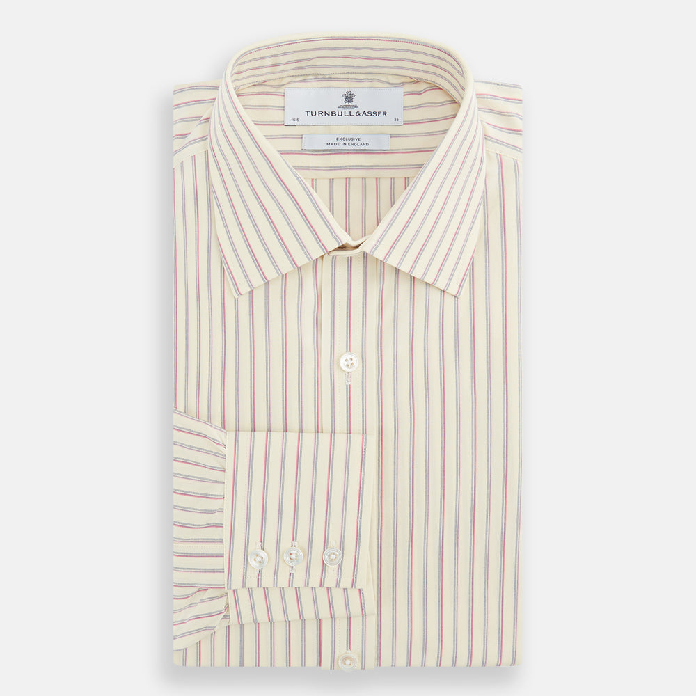 The Turnbull & Asser Pink Double Stripe Mayfair Shirt features long sleeves, a pointed T&A collar, and buttoned cuffs, crafted from organic cotton with pink double stripes on white, shown laid flat against a light background.