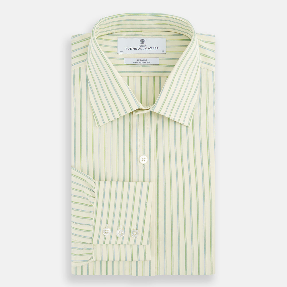 The Green Double Stripe Mayfair Shirt by Turnbull & Asser features light green and white vertical stripes, long sleeves, a T&A collar, and buttoned cuffs. Made from organic cotton and shown laid flat on a white background.
