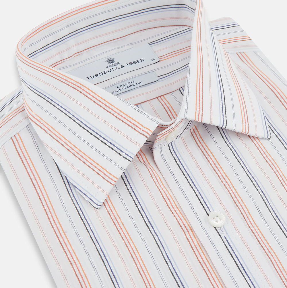 The Turnbull & Asser Orange and Blue Multi Stripe Mayfair Shirt is a long-sleeved, collared button-up made from organic cotton and features vibrant vertical stripes—an ideal summer staple.