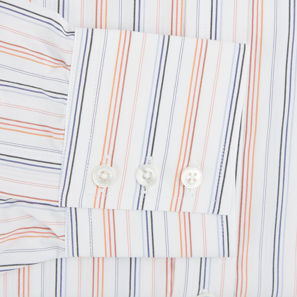 The Turnbull & Asser Orange and Blue Multi Stripe Mayfair Shirt is a long-sleeved, collared button-up made from organic cotton and features vibrant vertical stripes—an ideal summer staple.