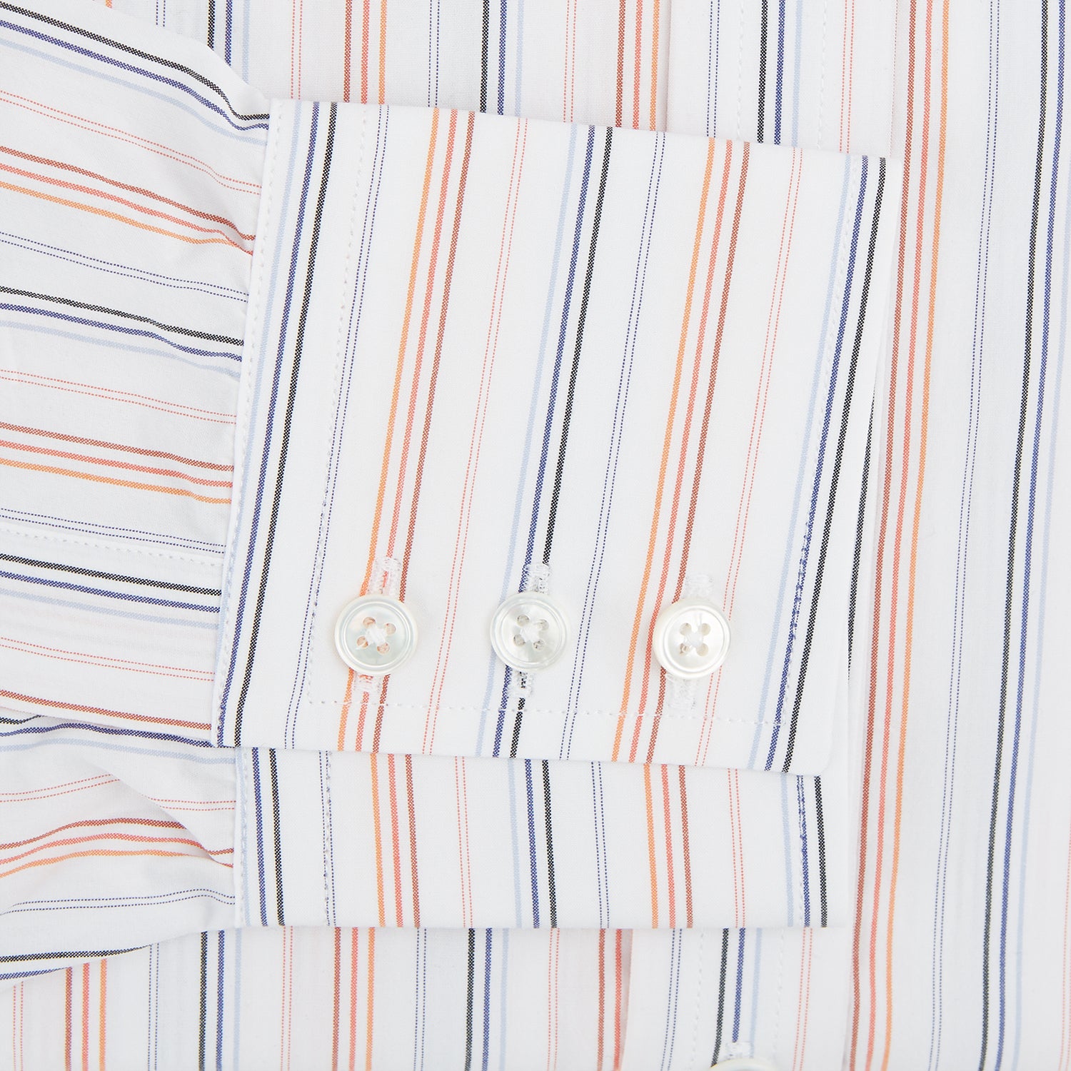 View 3 of product The Turnbull & Asser Orange and Blue Multi Stripe Mayfair Shirt is a long-sleeved, collared button-up made from organic cotton and features vibrant vertical stripes—an ideal summer staple.