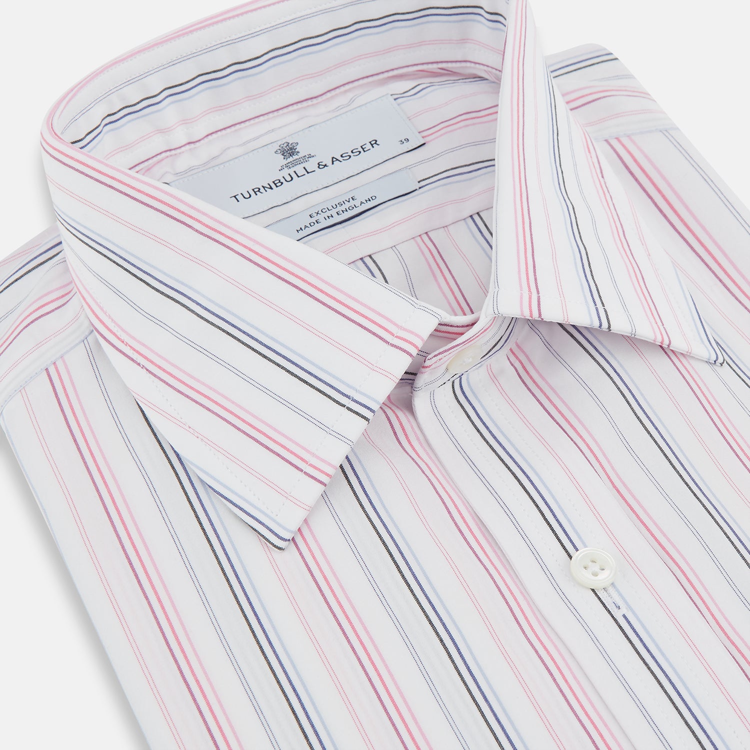 View 2 of product The Pink and Blue Multi Stripe Mayfair Shirt by Turnbull & Asser features vertical pastel stripes, a T&A collar, and buttoned cuffs. Made from organic cotton, the long-sleeve shirt is shown on a plain white background.