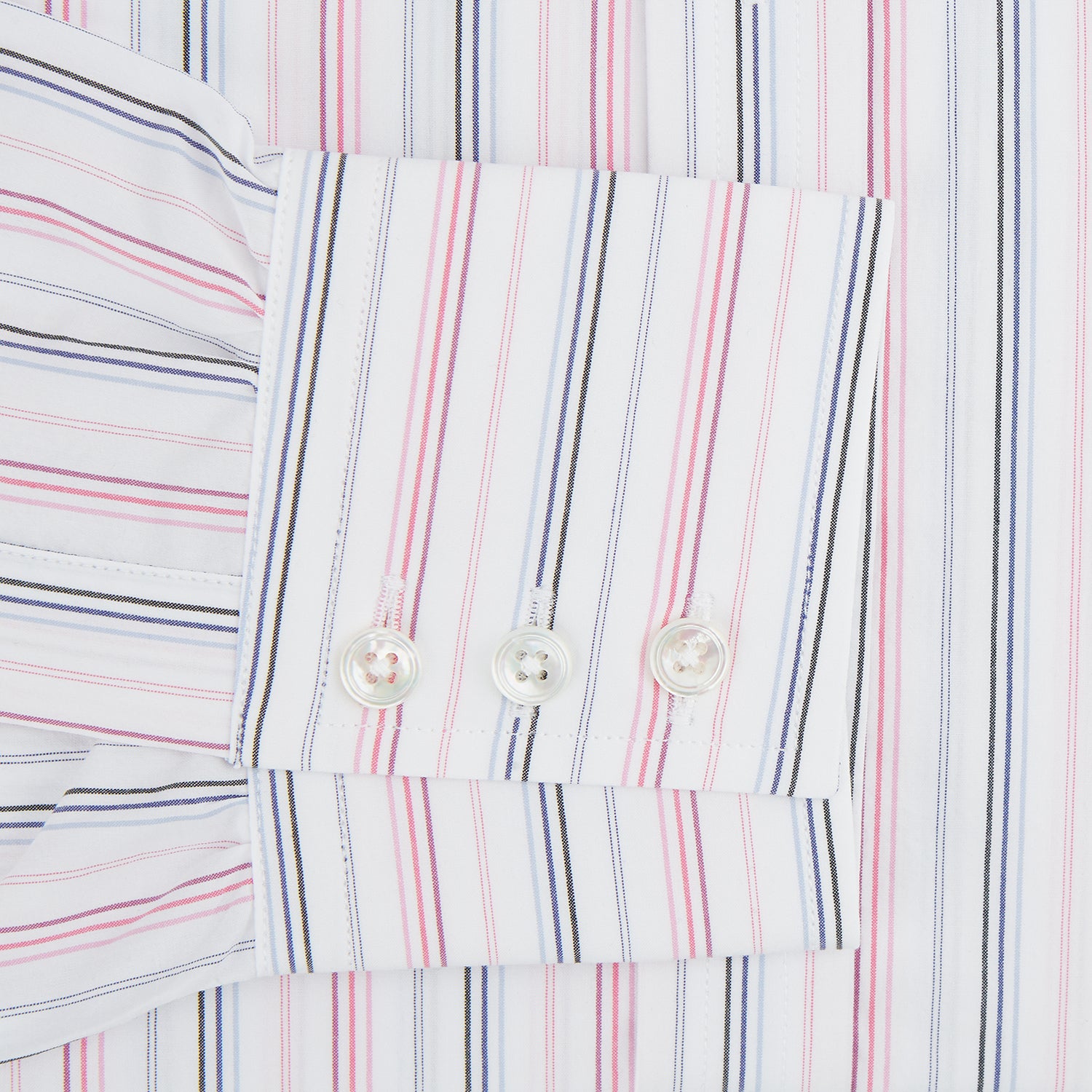 View 3 of product The Pink and Blue Multi Stripe Mayfair Shirt by Turnbull & Asser features vertical pastel stripes, a T&A collar, and buttoned cuffs. Made from organic cotton, the long-sleeve shirt is shown on a plain white background.