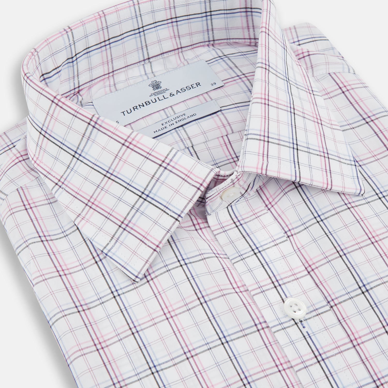 View 2 of product The Purple and Blue Multi Check Mayfair Shirt by Turnbull & Asser is a long-sleeved, organic cotton button-down with a classic T&A collar, featuring a white base with blue, purple, and pink checks, displayed on a white background.