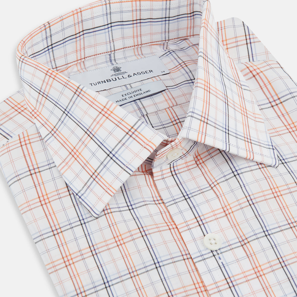 The Orange and Blue Multi Check Mayfair Shirt by Turnbull & Asser is an organic cotton summer staple, featuring long sleeves and a light blue, orange, and white plaid pattern.