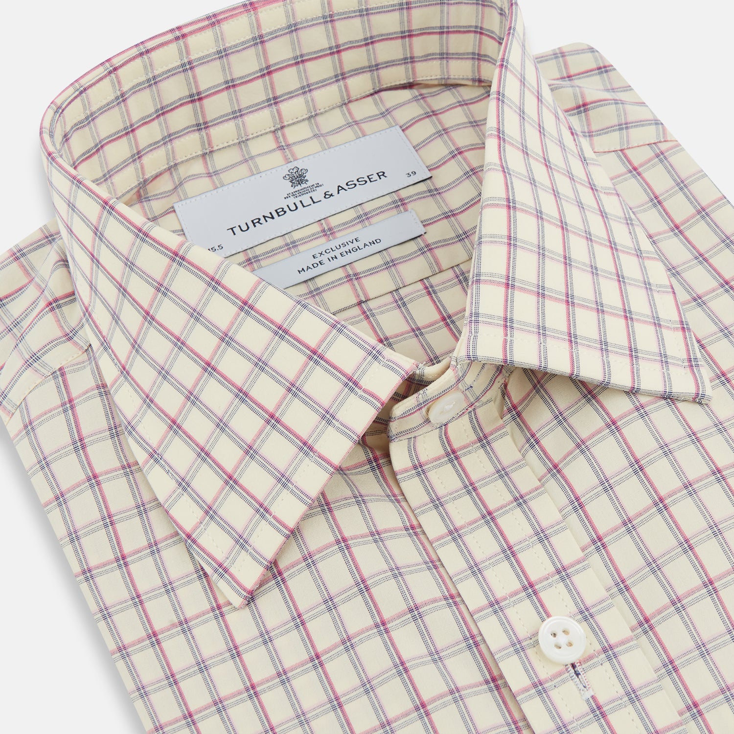 View 2 of product The Turnbull & Asser Pink Multi Check Mayfair Shirt features a T&A collar, long sleeves, and a pink check pattern on white organic cotton, shown against a plain white background.