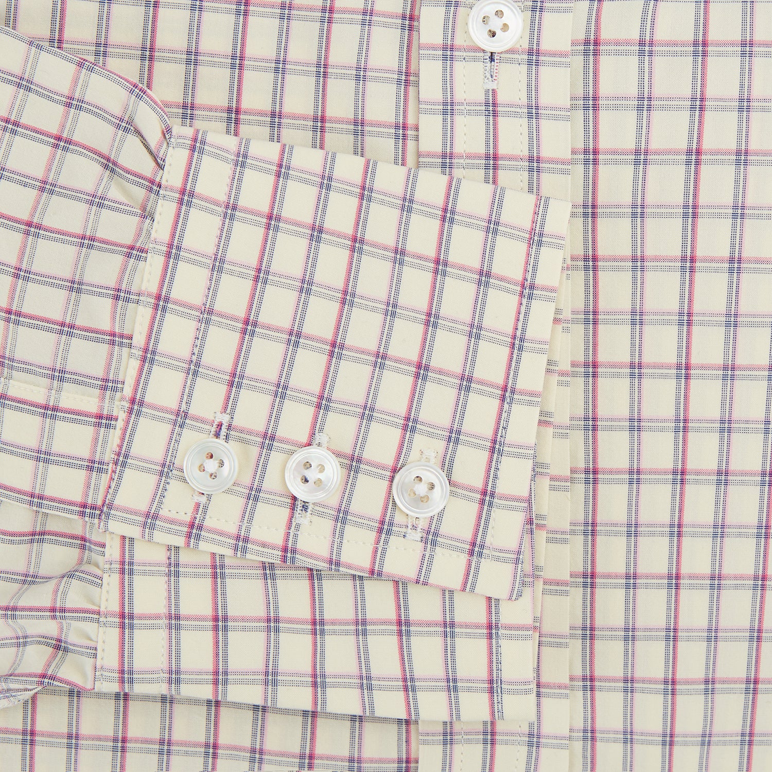 View 3 of product The Turnbull & Asser Pink Multi Check Mayfair Shirt features a T&A collar, long sleeves, and a pink check pattern on white organic cotton, shown against a plain white background.