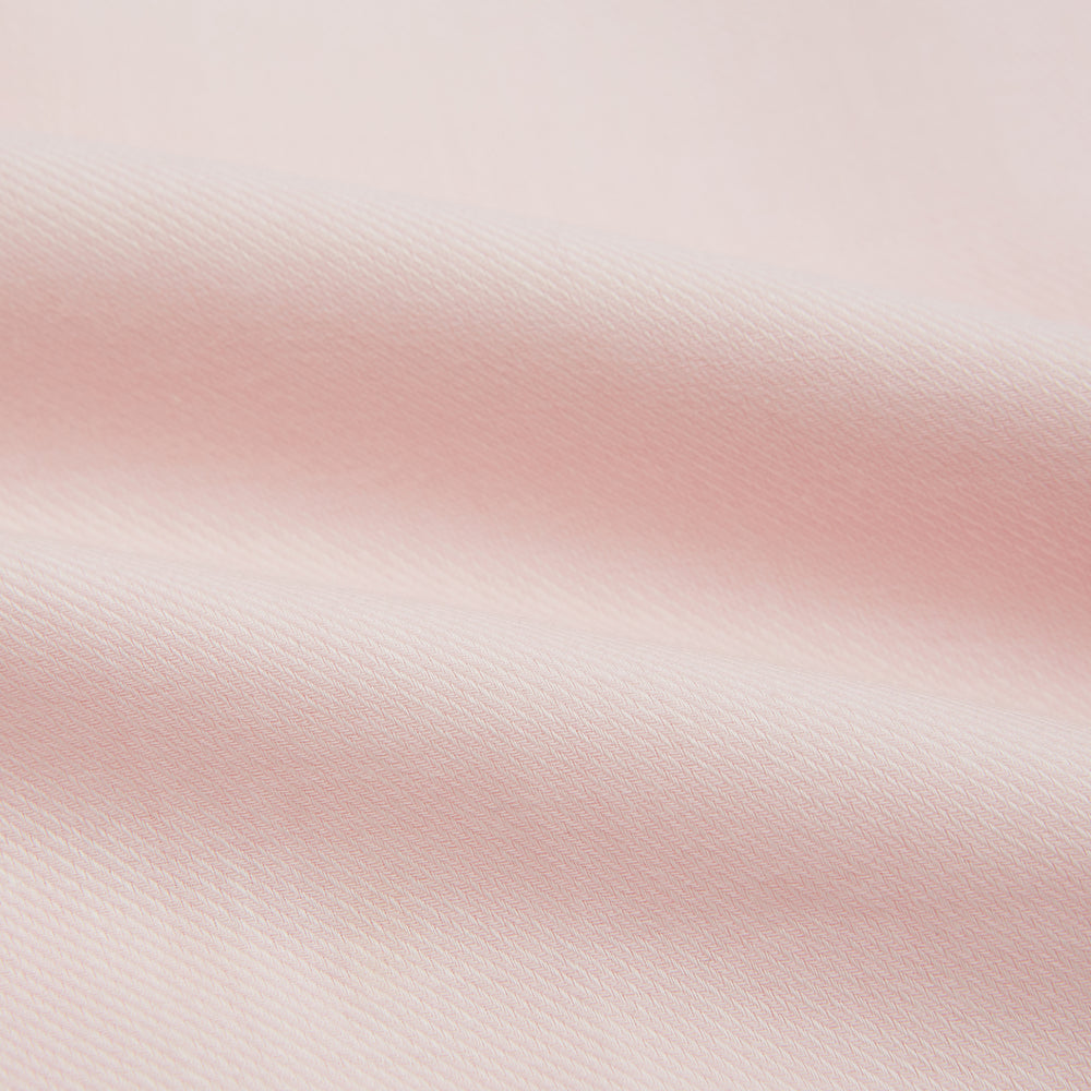 The Turnbull & Asser Pale Pink Cotton Cashmere Chelsea Shirt features long sleeves, a chest pocket, spread collar, and buttoned cuffs. Crafted from a luxurious cotton-cashmere blend, it's shown laid flat on a white background.